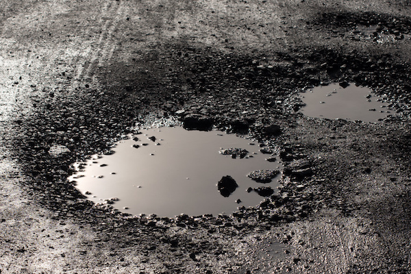 How to Safeguard Your Vehicle Against Potholes